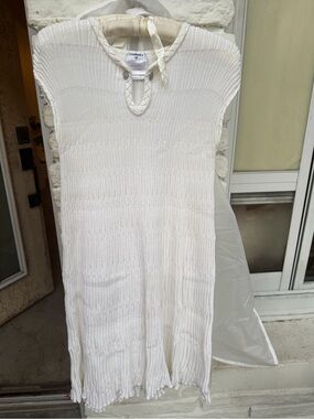 CHANEL Cream Ribbed Knit Top with Chain Accent